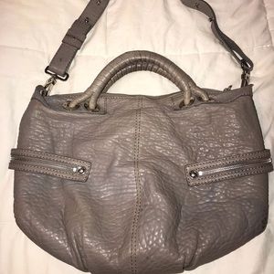 Gray/beige Michele purse with silver details.